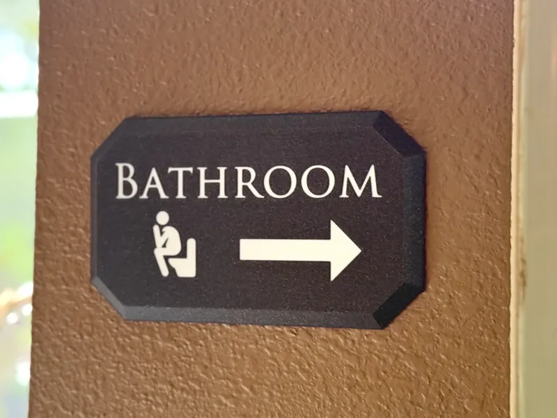 Bathroom Sign with Arrow