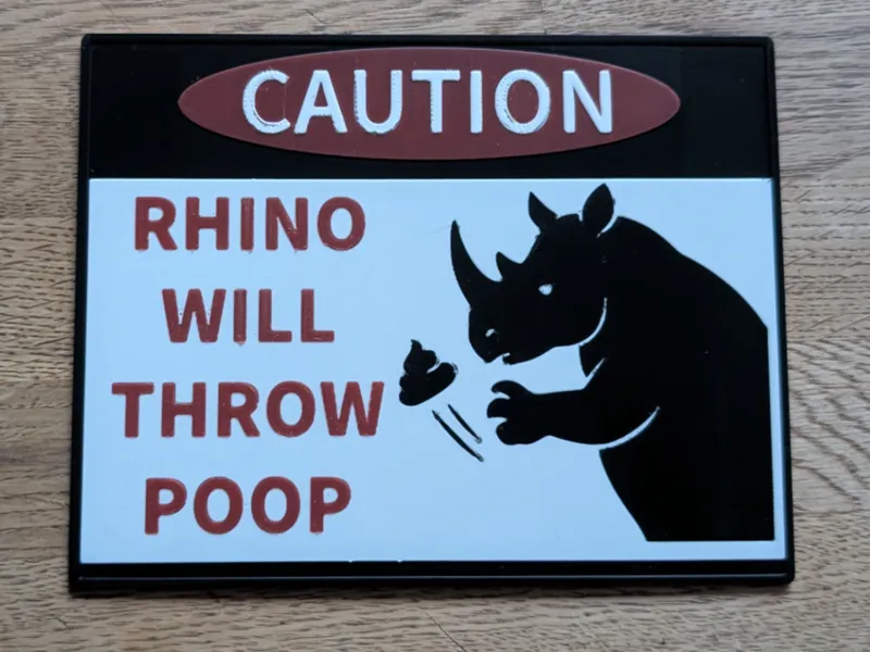 CAUTION - RHINO WILL THROW POOP Warnschild