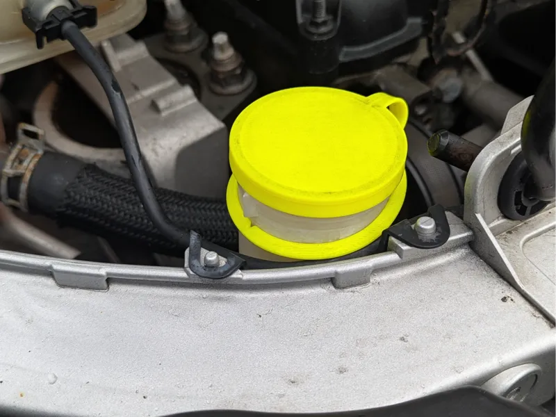 Ford Focus/Transit Connect windshield washer cap.