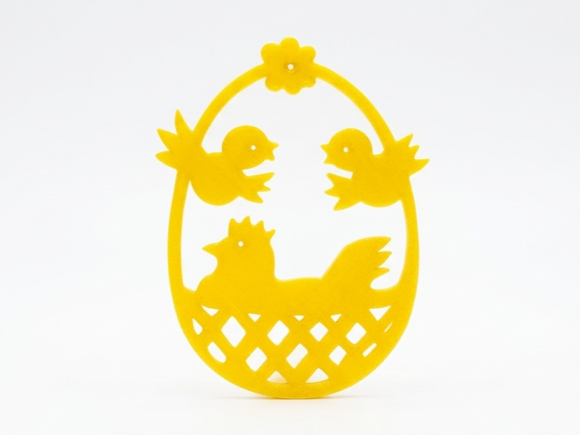 Osterschmuck: Frühlings-Ei mit Henne im Korb Deko