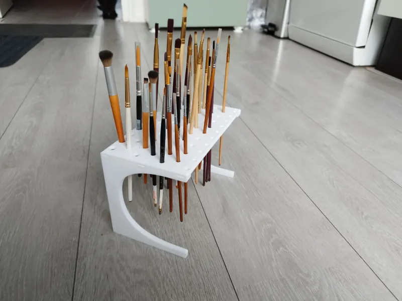 Floating paintbrush holder / stand