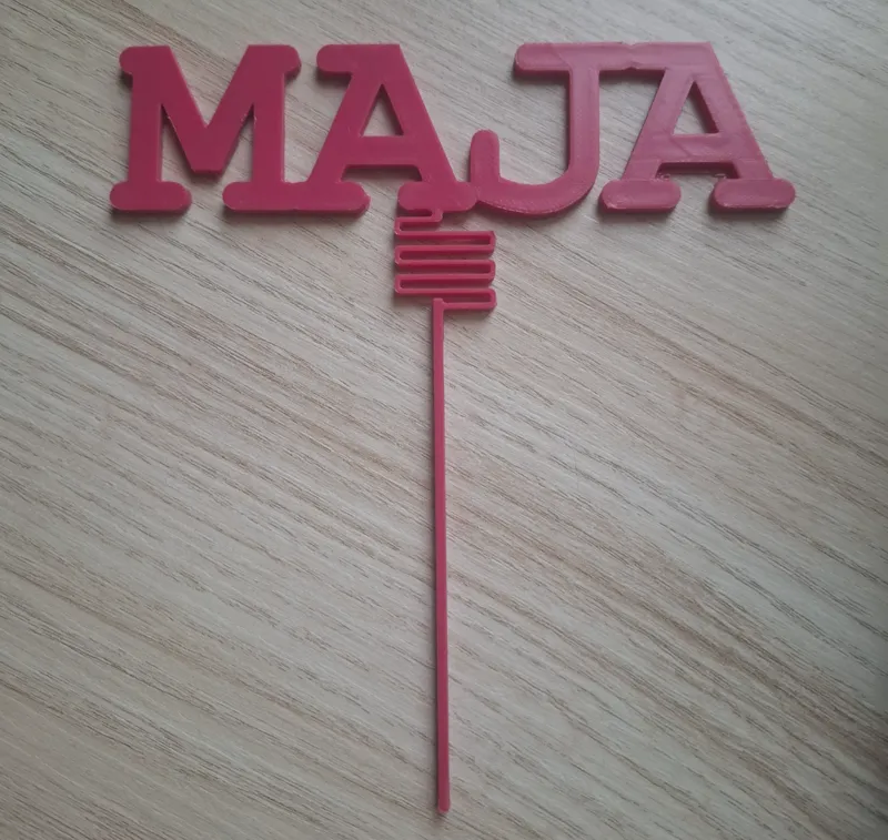 Maja - Cake topper on a spring