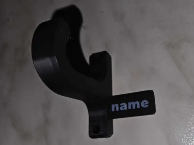 Towel holder with customizable nameplate