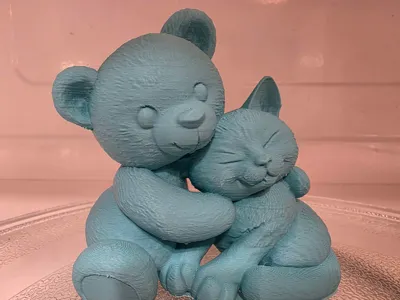 Cuddling Teddy Bear And Cat