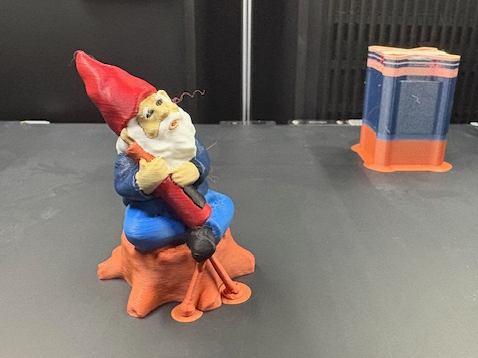 Mini (sitting on log with bottle) gnome