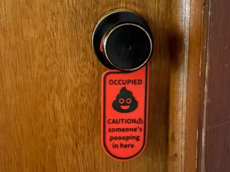 bathroom poop door sign