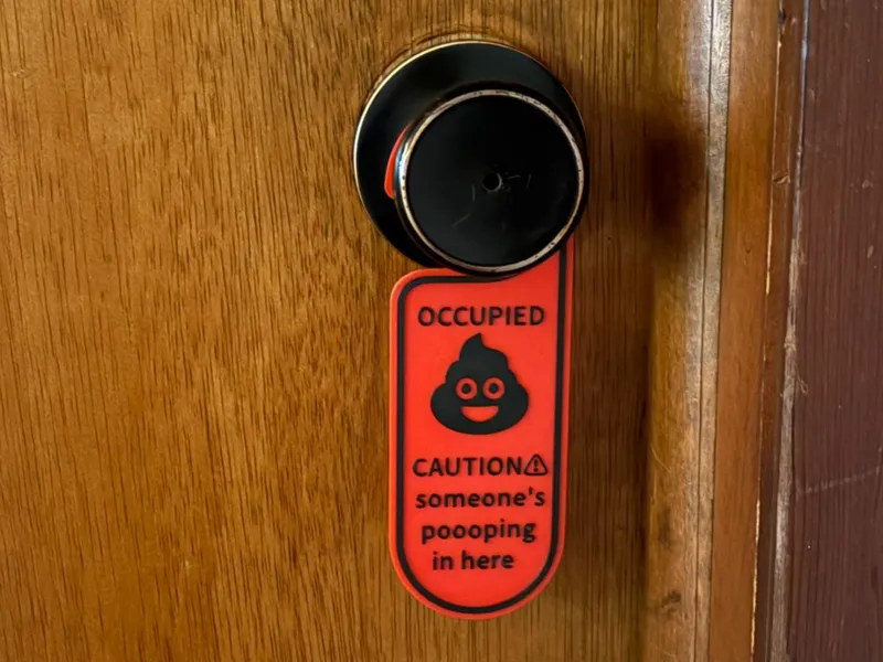bathroom poop door sign