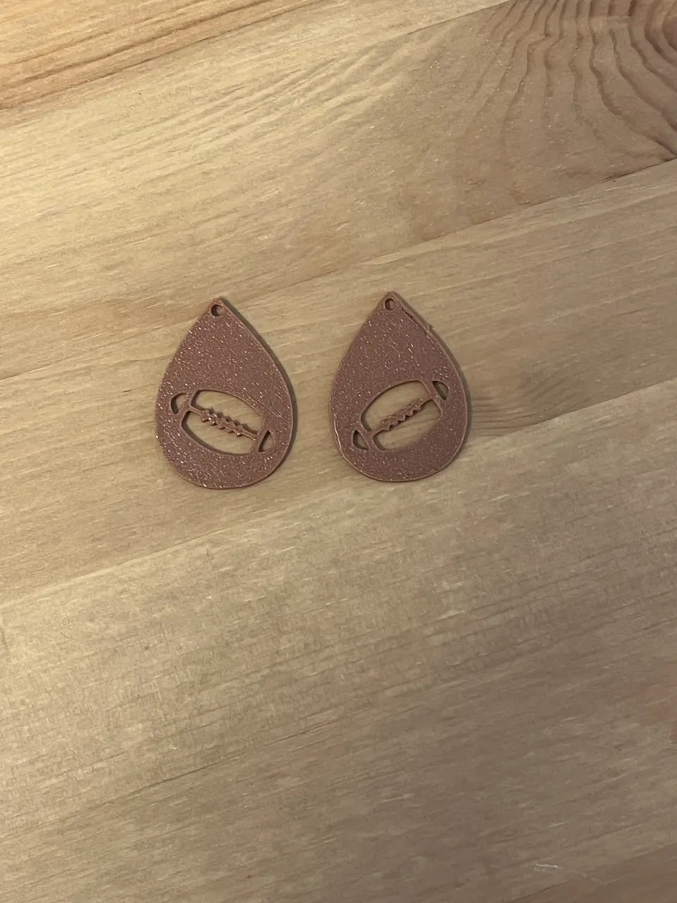 rugby ball earrings view 2