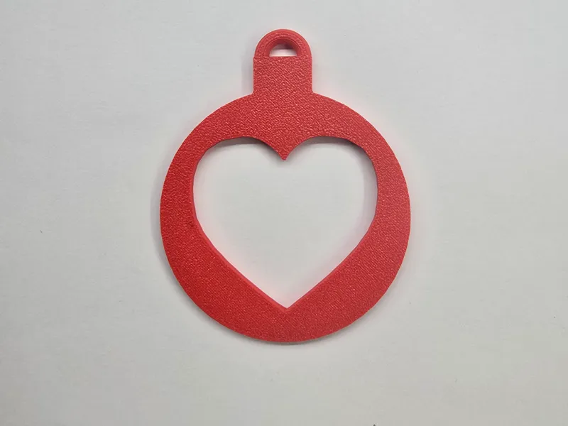 a bauble with a heart cut out