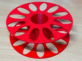 Filament spool with thread