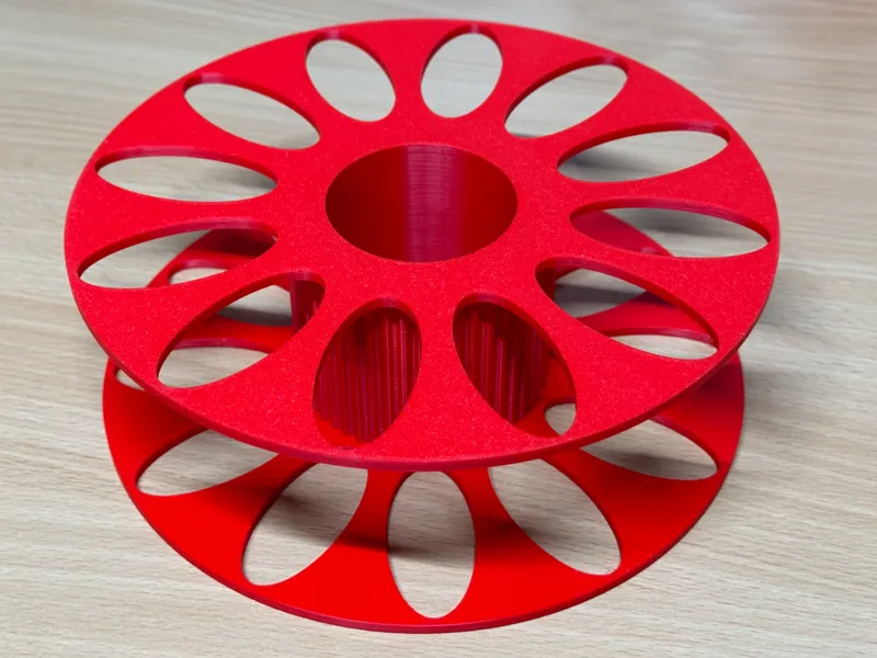 Filament spool with thread
