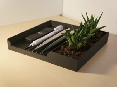 Stationery stand with plant pot