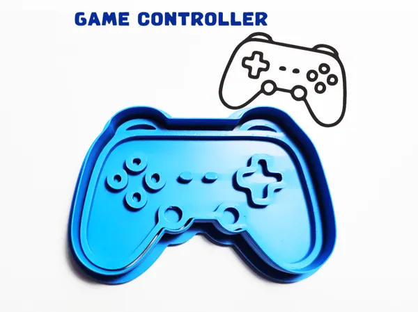 Emporte-pièce/tampon manette de jeu