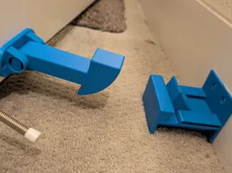 Push to release door stopper