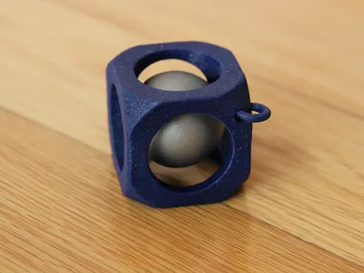 Ball keychain inside a cube