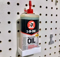 Support pegboard pour flacon d'huile 3-en-1 — photo 1