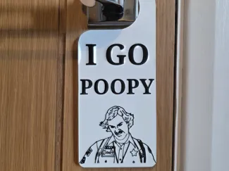 scary movie i go poopy door hanger