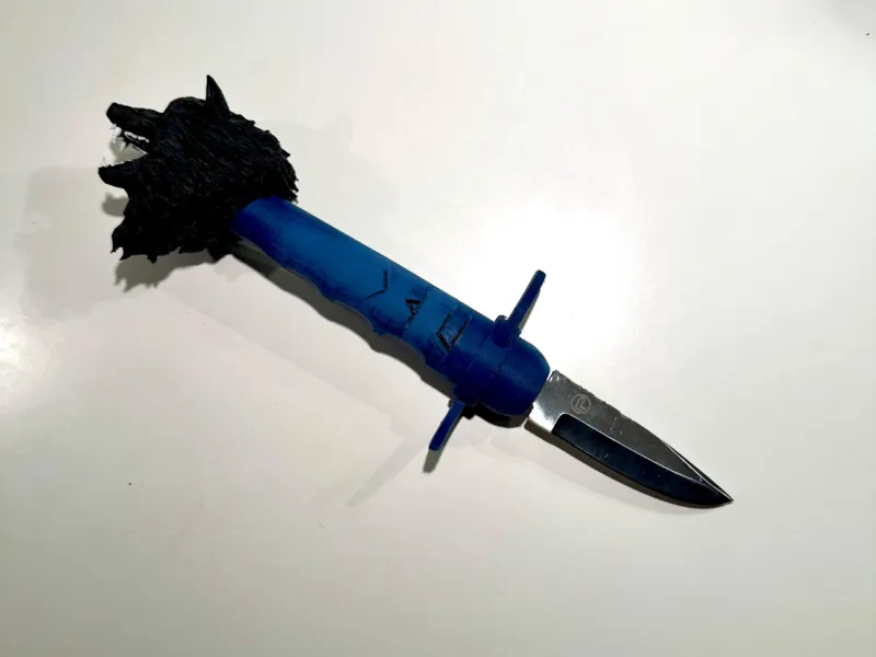 Wolf knife handle designed by a fully blind person
