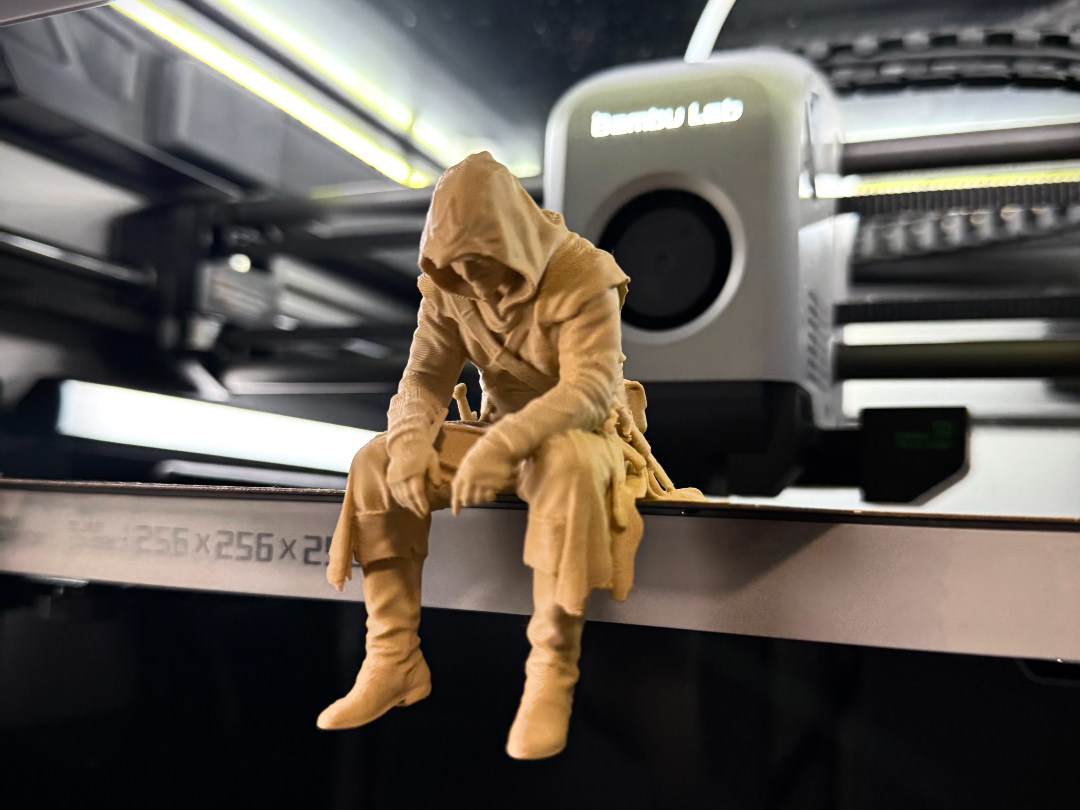 Sad Assassin's Creed sitting on a ledge Figurine