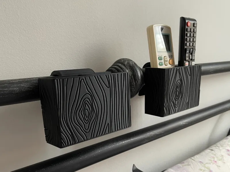 Remote control holder for tube bed headboard