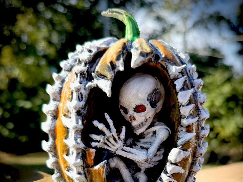 Skeleton in pumpkin
