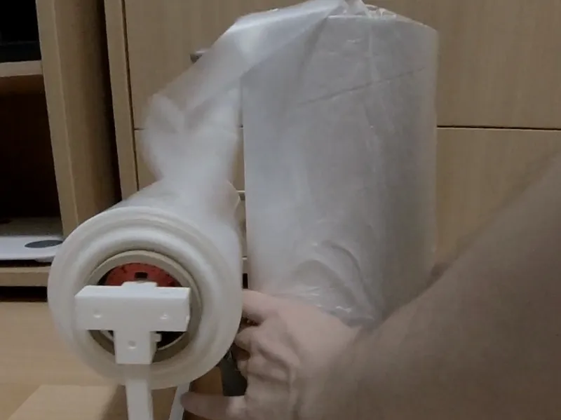 Roll Dispenser for Diaper Bin Refills