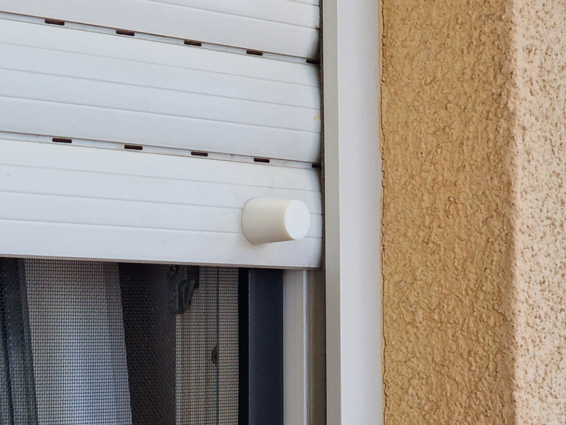 Stopper for window roller shutters