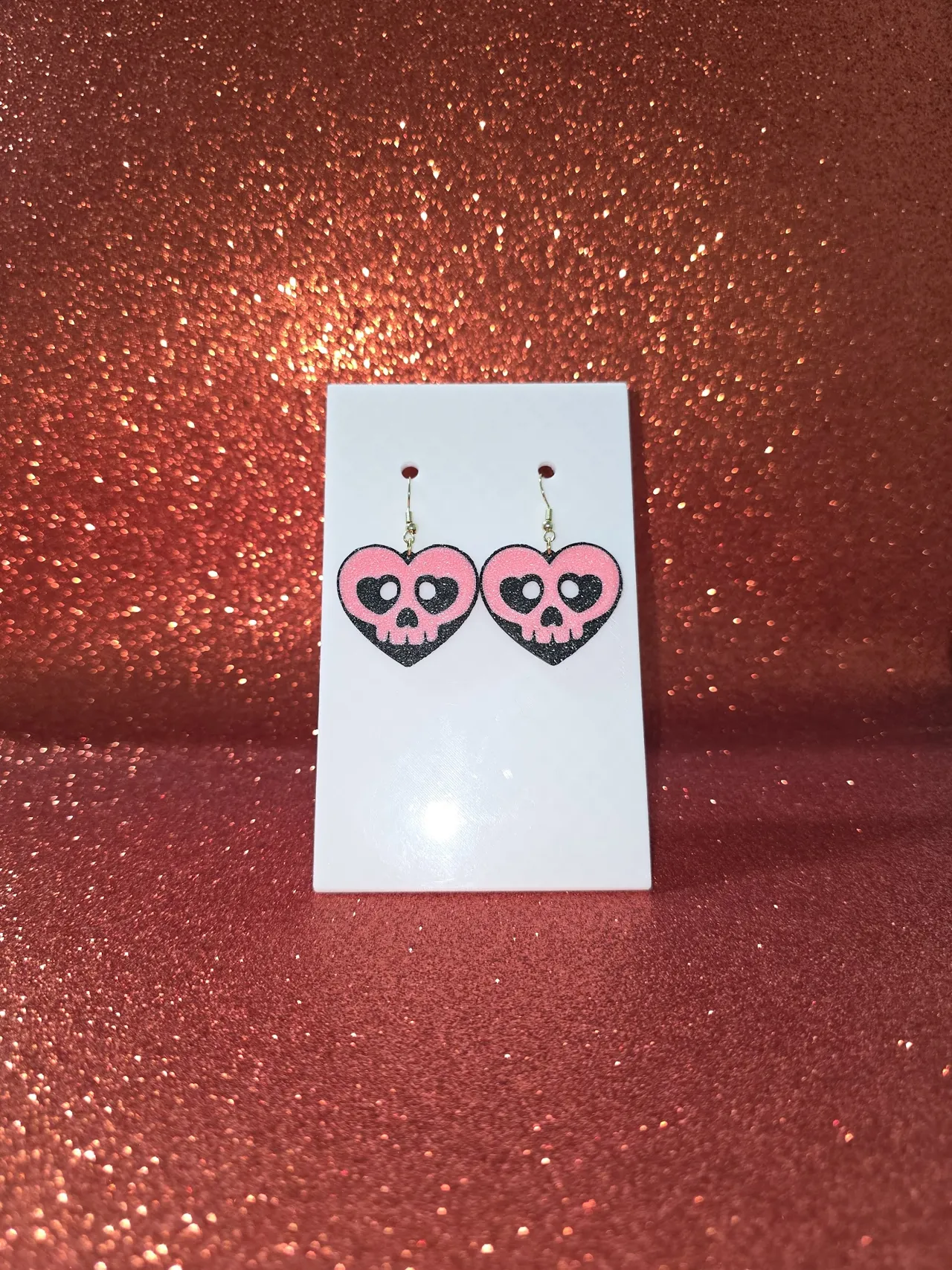 A skull heart earrings view 2