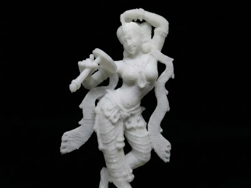 Apsara applying vermillion