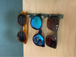 Sunglasses wall mounted holder