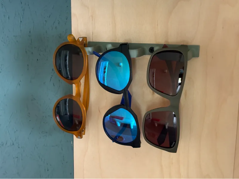 Sunglasses wall mounted holder