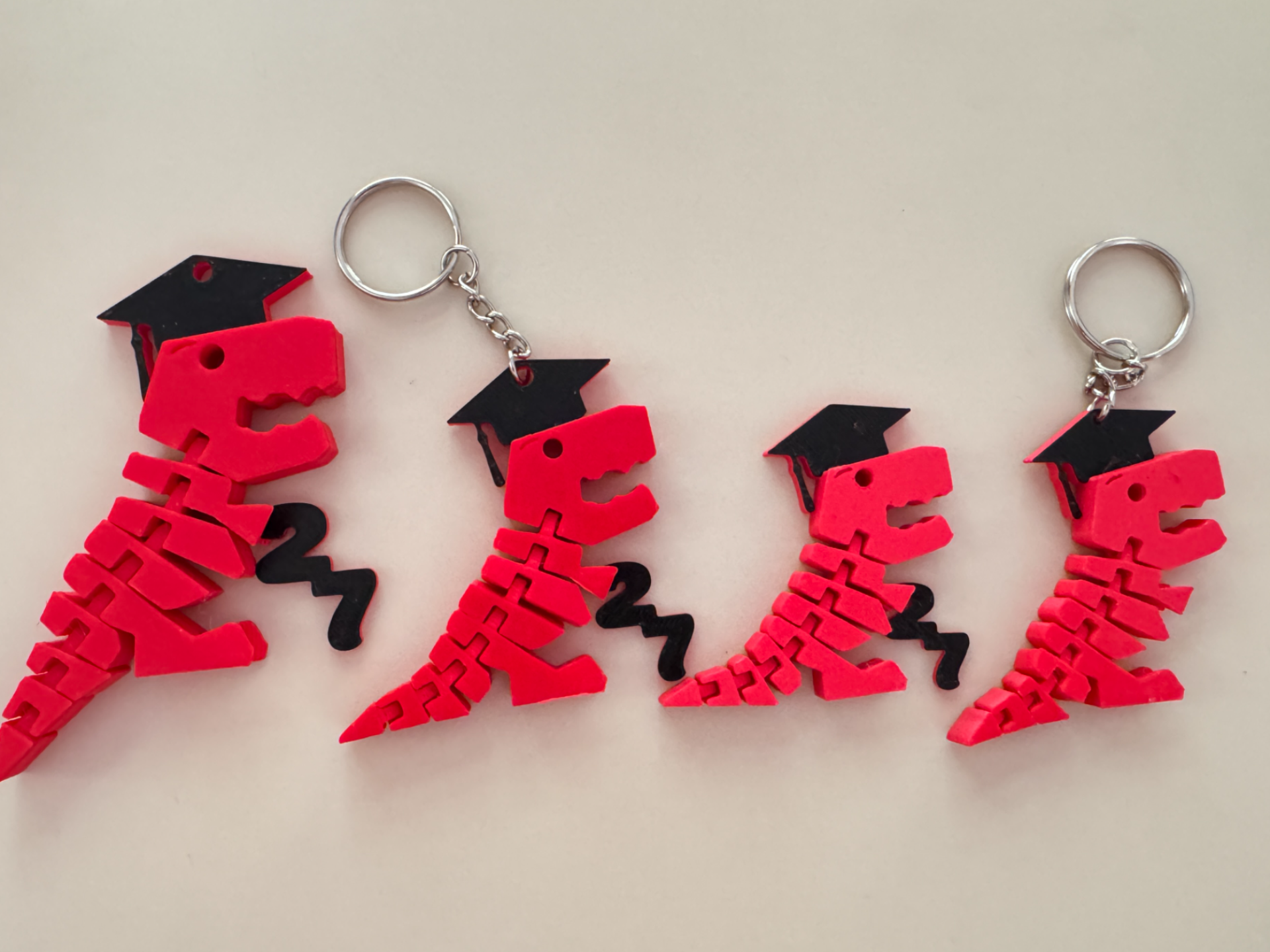 Flexy Rex Graduates 2027 + keychains