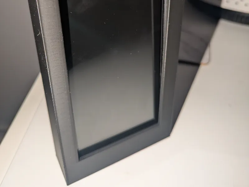 Wall phone holder - for use with command strips 
