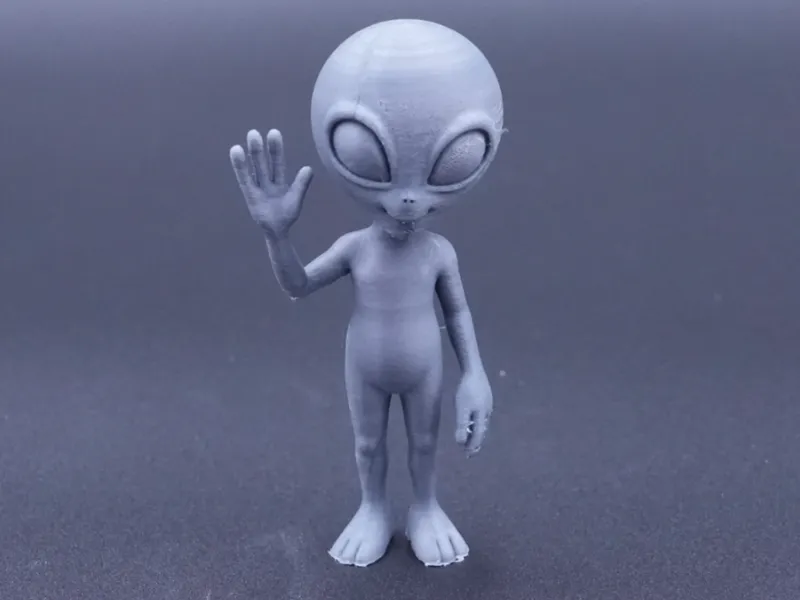 waving grey alien