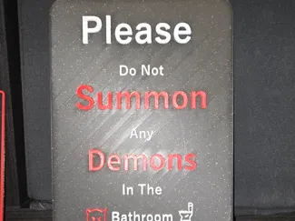 summon demons bathroom sign