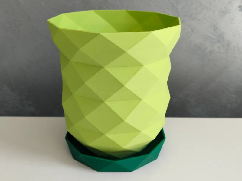 Plant pot with holes and saucer