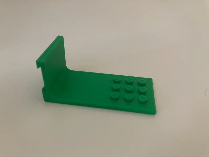 Brick holder for multiboard rail