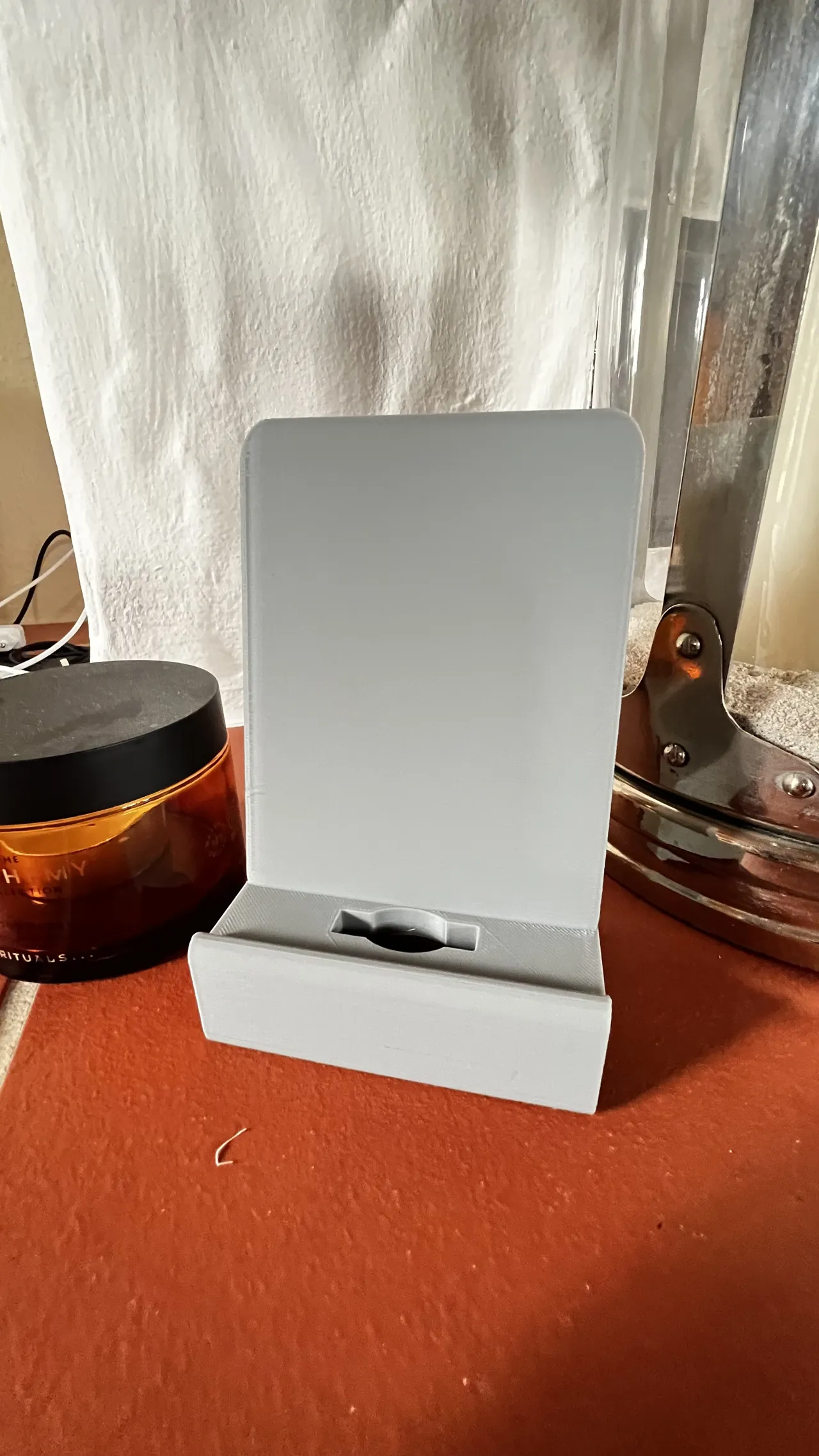 Phone-stand with holes for a charging cable view 2