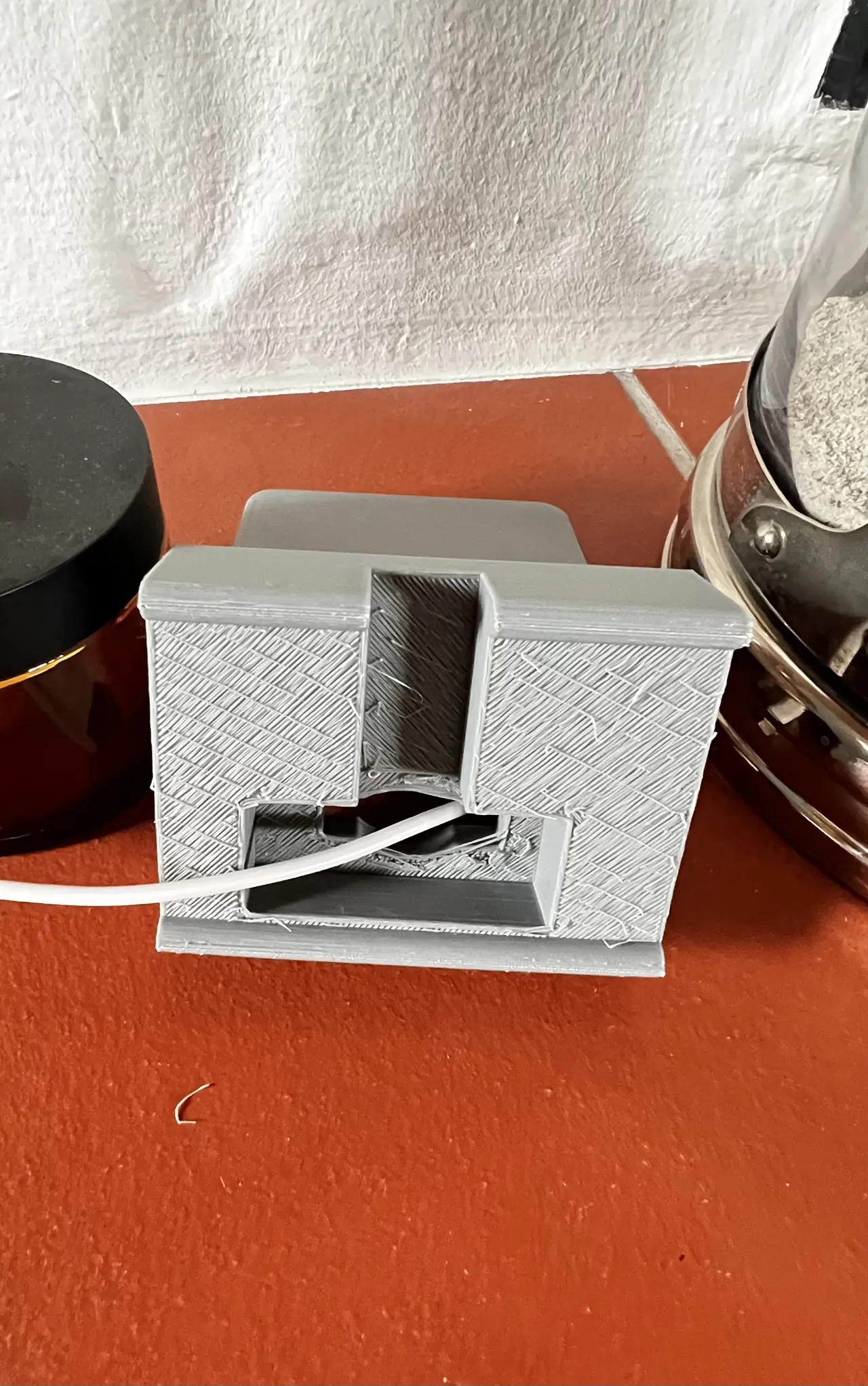 Phone-stand with holes for a charging cable view 3
