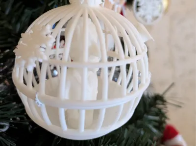 Sarkozy Christmas ornament in a cage