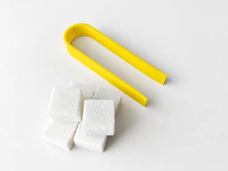 Sugar cubes with tongs for pretend play