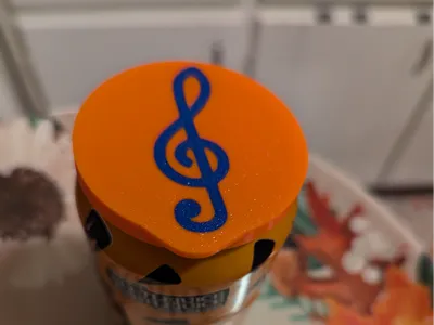 Soda can cover with treble clef