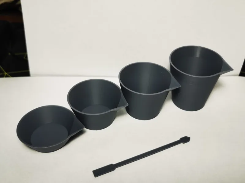 Stackable paint mixing cups with stirrer, 4  sizes