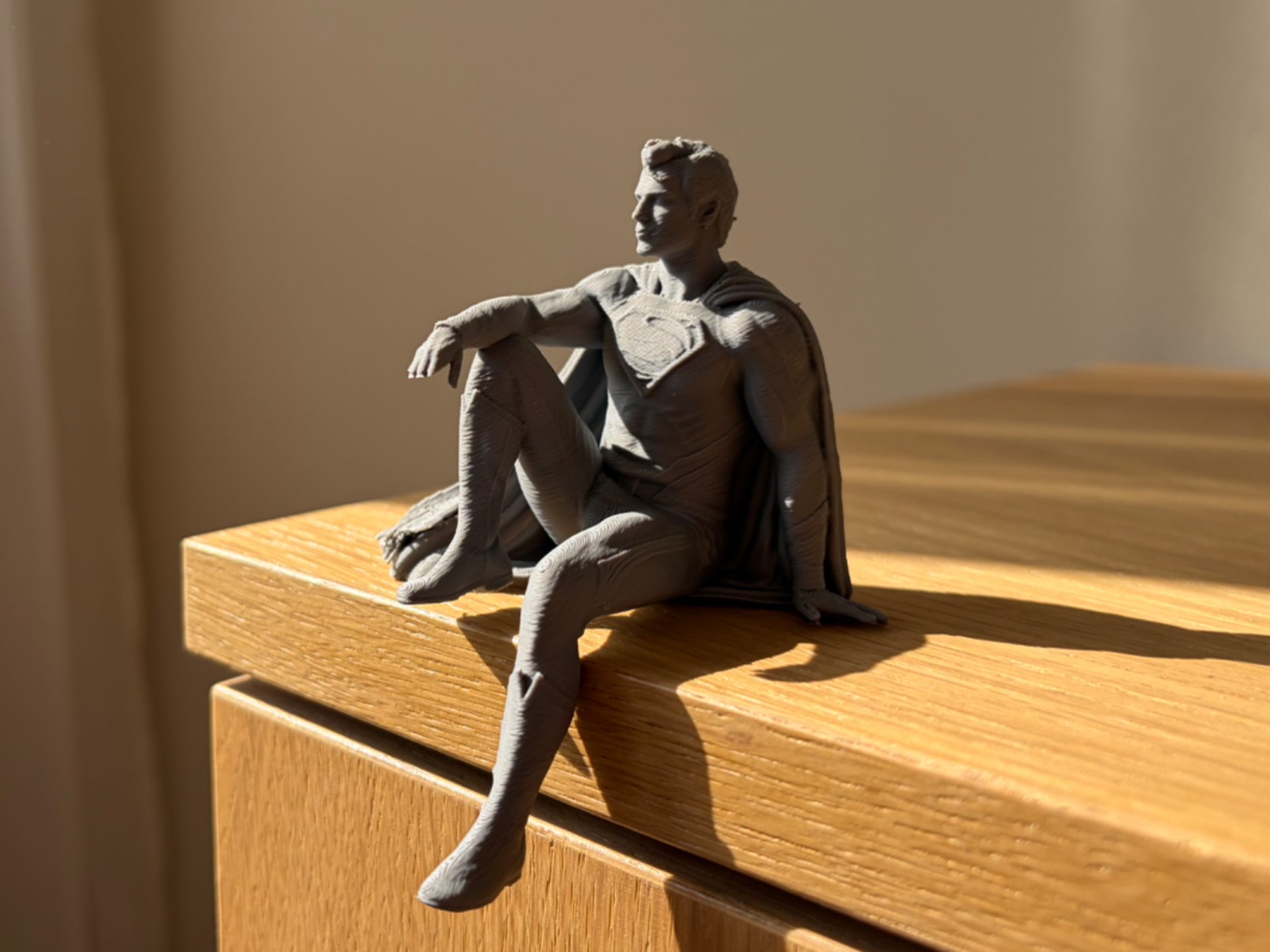 Man of Steel Sitting on Ledge | Superman DC Figure