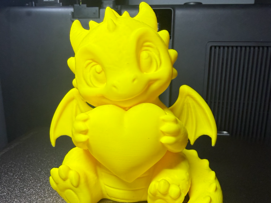 Baby Dragon Holding Heart