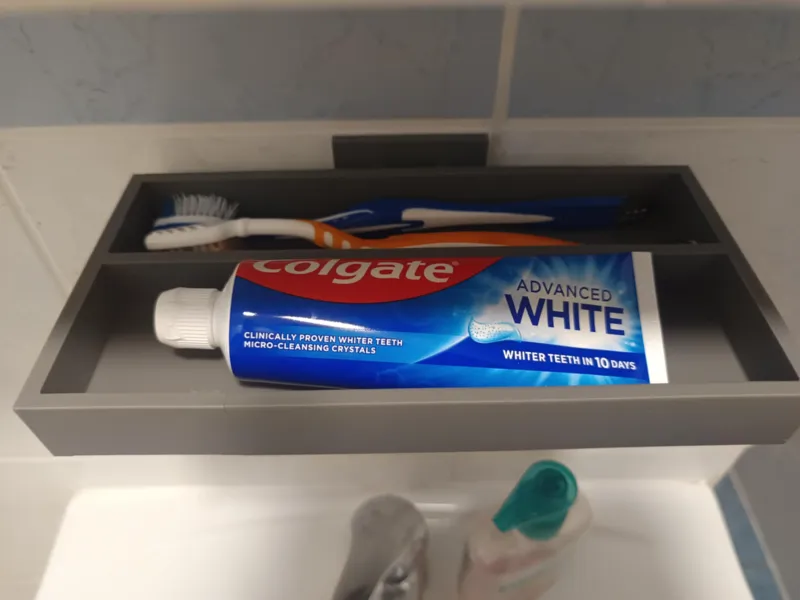Bathroom holder for toothpaste and toothbrushes