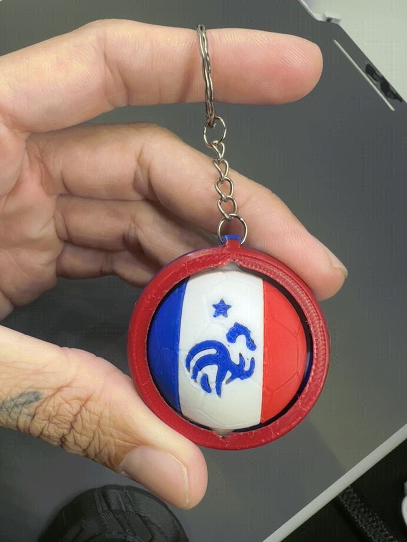 Chaveiro giratório France multicor
