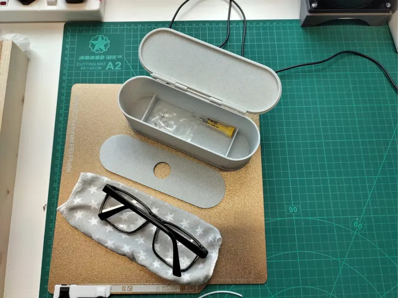 Glasses box with storage bottom.