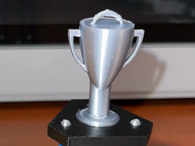 Three pillar trophy with cup, and ornament hook
