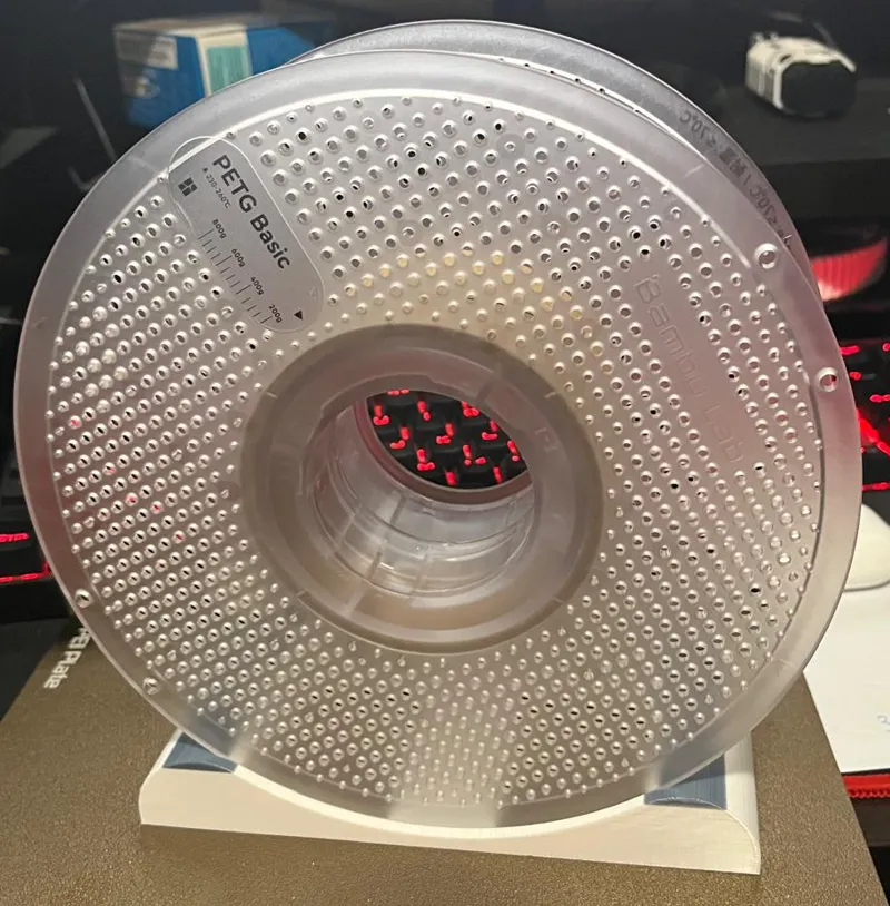Filament spool holder for shelf or cabinet